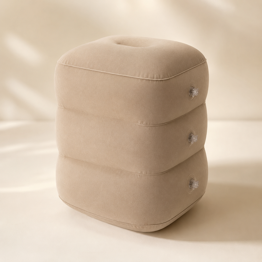 Lumora inflatable travel footrest pillow, beige, on a cream studio background