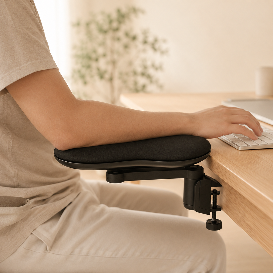 Person typing with their forearm resting on the Lumora wrist rest